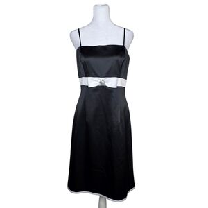 B. Moss black and white satin sleeveless cocktail dress with a white bow Size 14